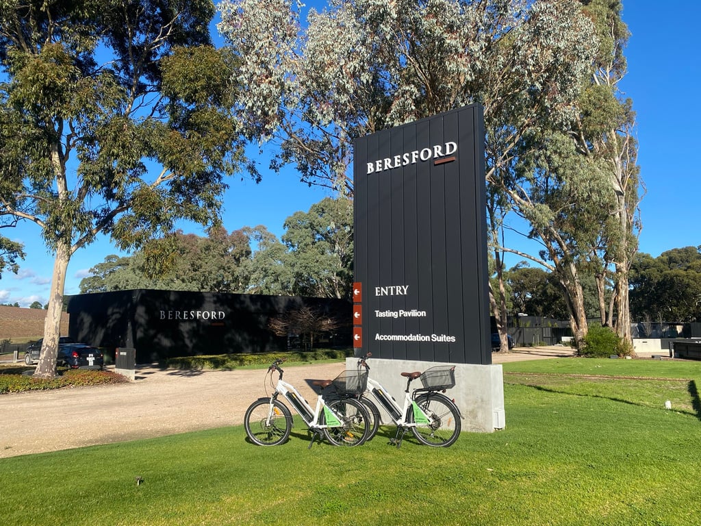 Two bicycles are parked in front of a Bertesford Estate