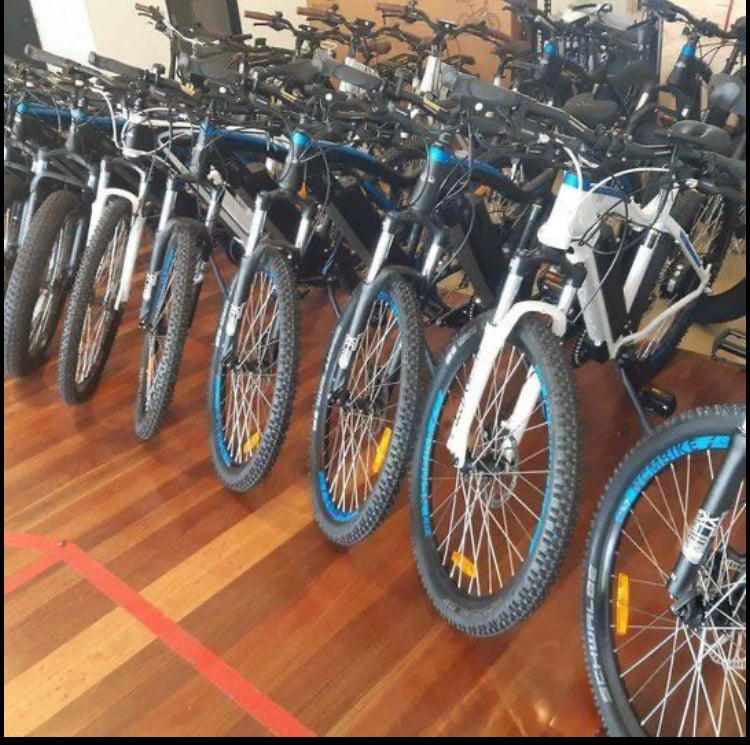 several bicycles are lined up in a row