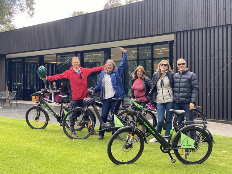Five people with their SA eBikes in front of Beresford Tasting Pavilion, McLaren Flat