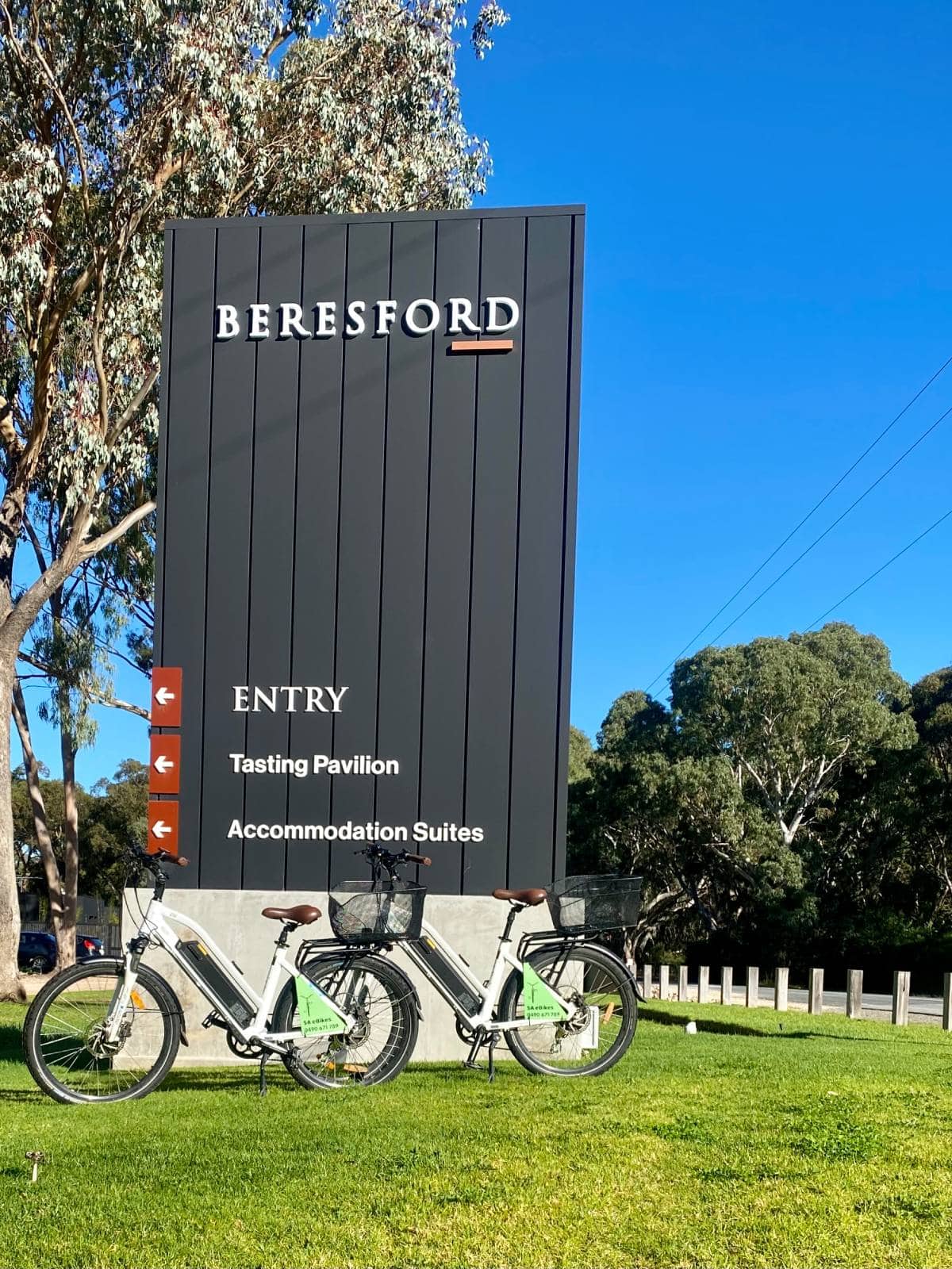 SA eBikes standing beside the Beresford sign