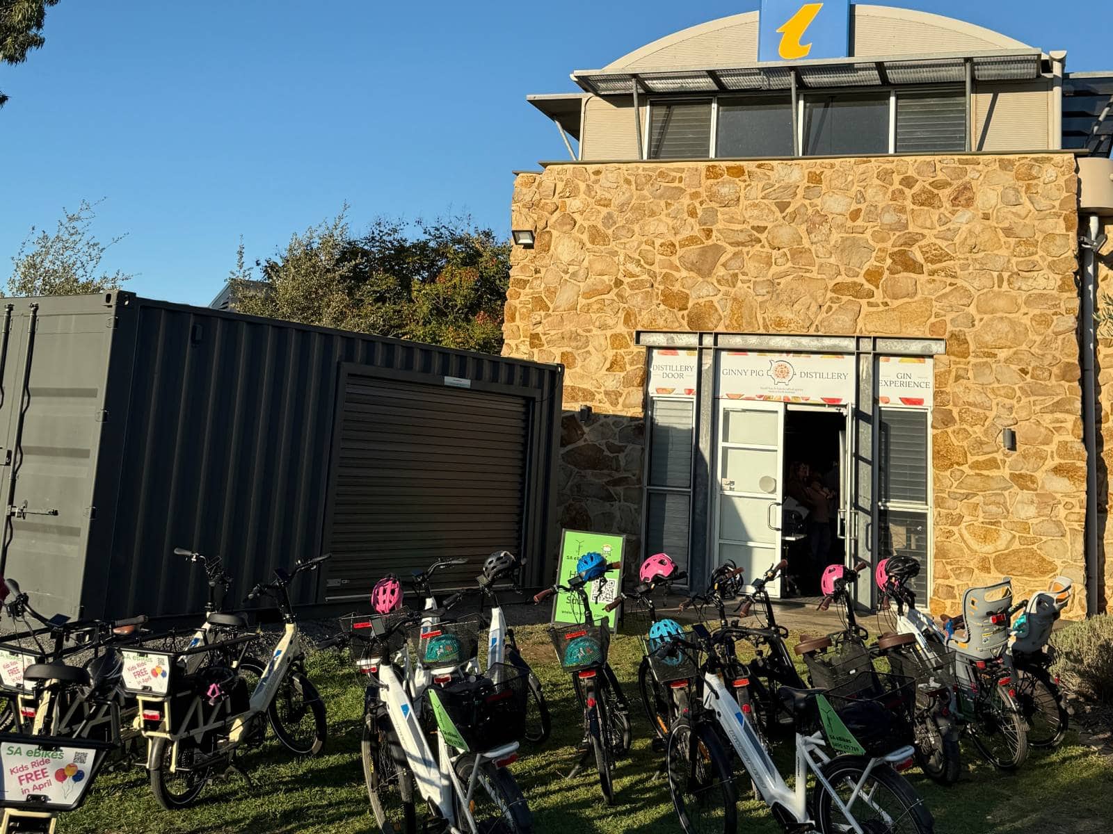 A dozen eBikes on the lawn outside the McLaren Vale Visitor Centre