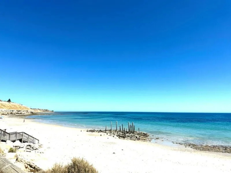 white sand beach with Port Willunga jetty pilons in the background