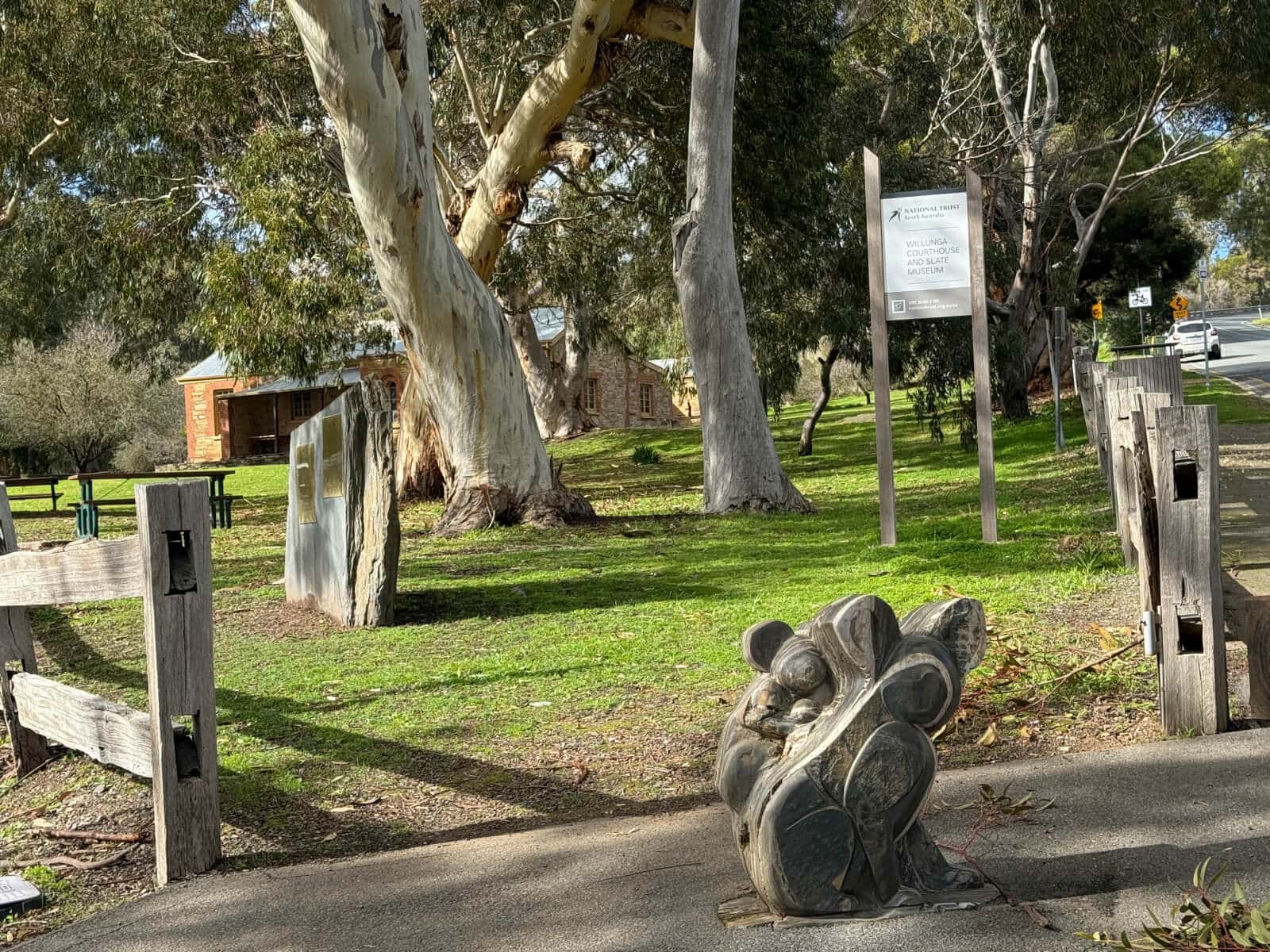 Slate sculpture of a koala with baby koala on its back at the entrance to the Willunga Slate Museum