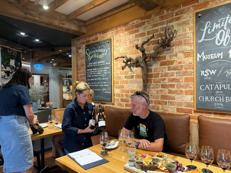 Man enjoying a wine tasting and platter experience at Wirra Wirra cellar door, McLaren Vale