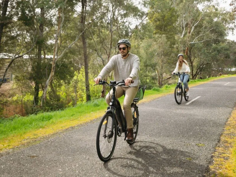 A man and a woman riding ebikes on the Shiraz Trail, McLaren Vale