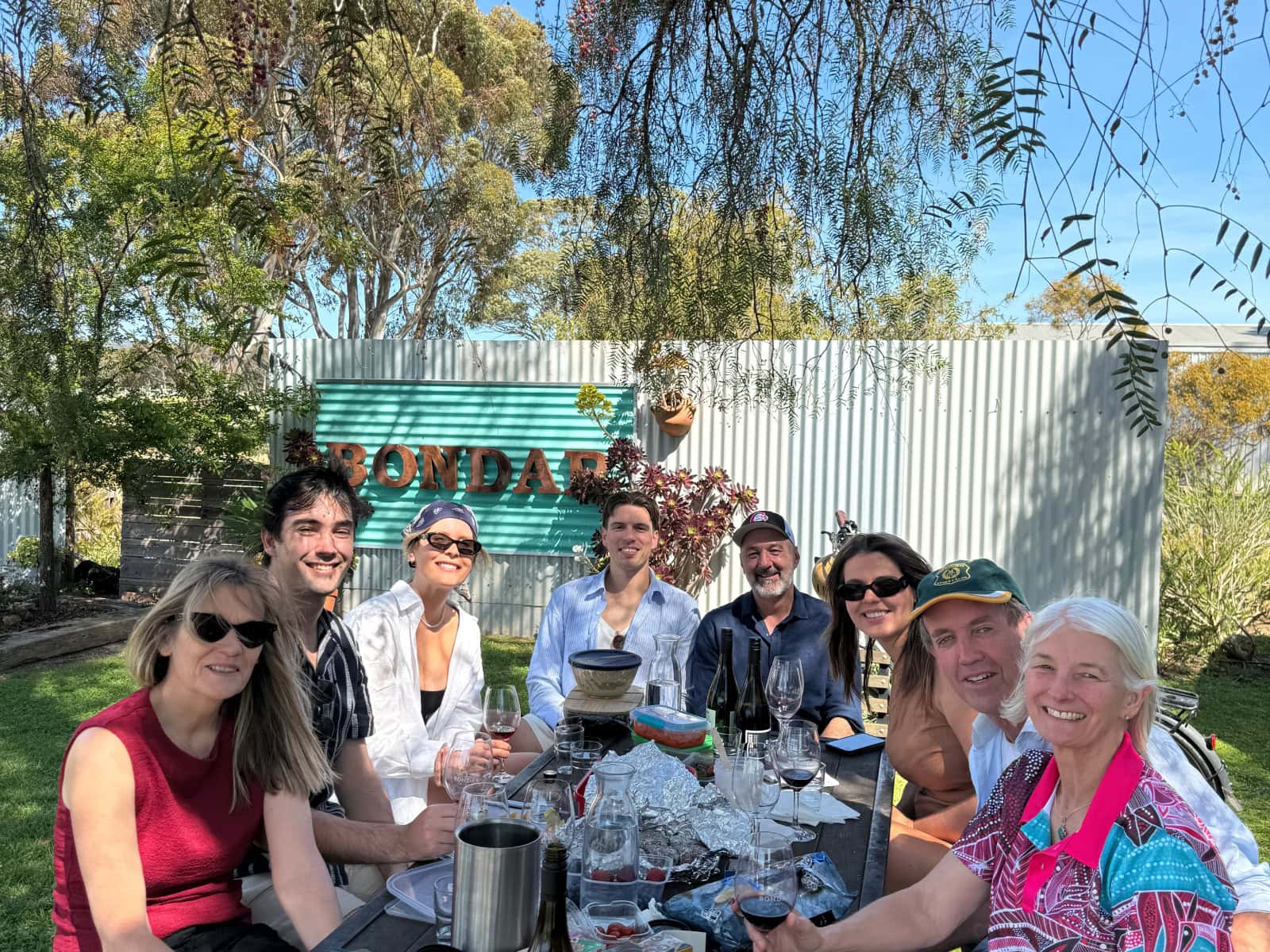 Bondar McLaren Vale Family group enjoying an wine whilst seated at an outdoor table at Bondar Cellar Door, McLaren Vale