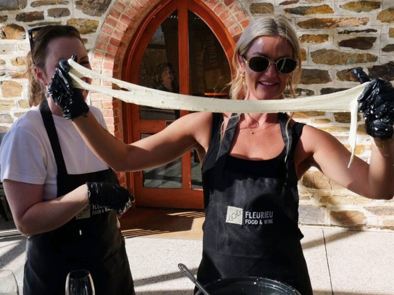 Woman stretching cheese