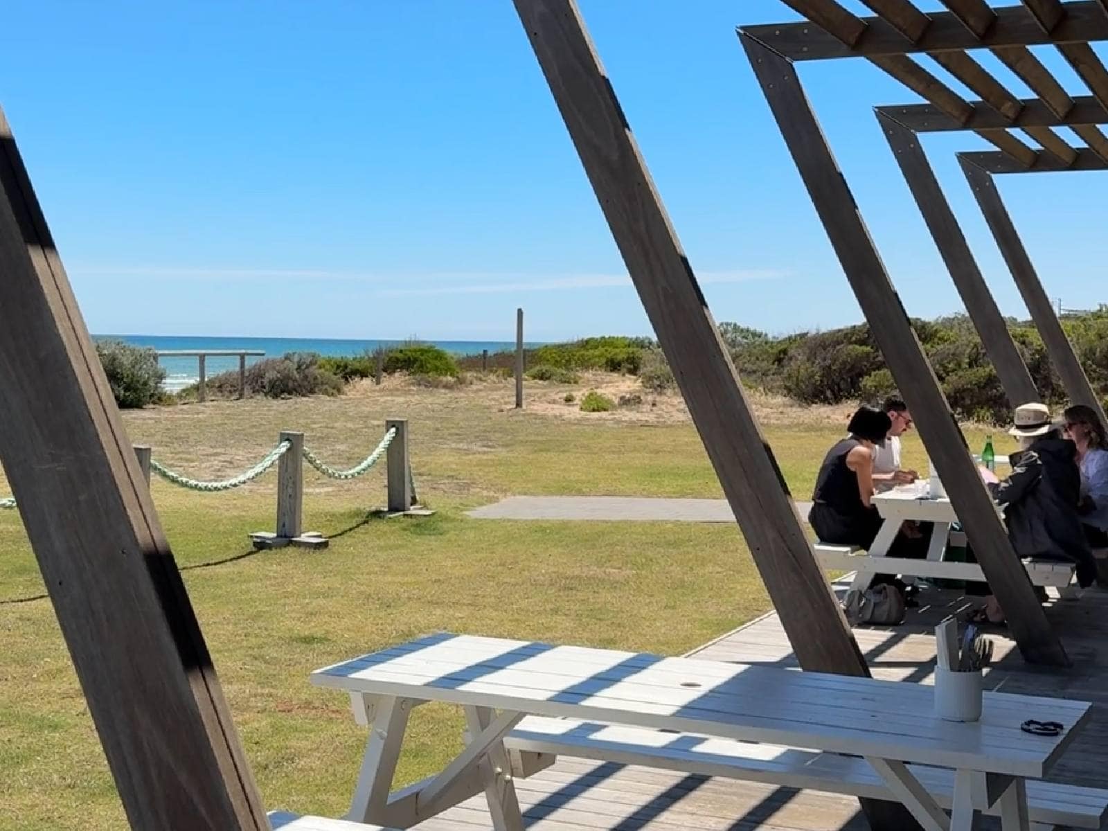 Outdoor tables at Silver Sands Beach Club