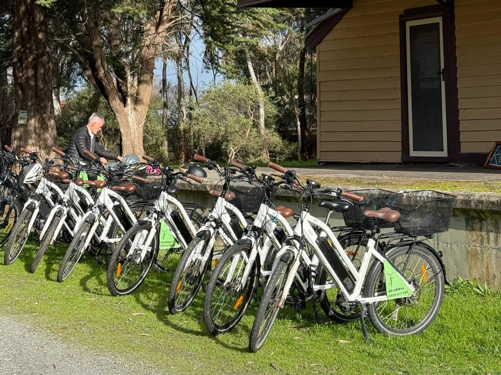 A row of ebikes in front of the old Willunga Railway Station