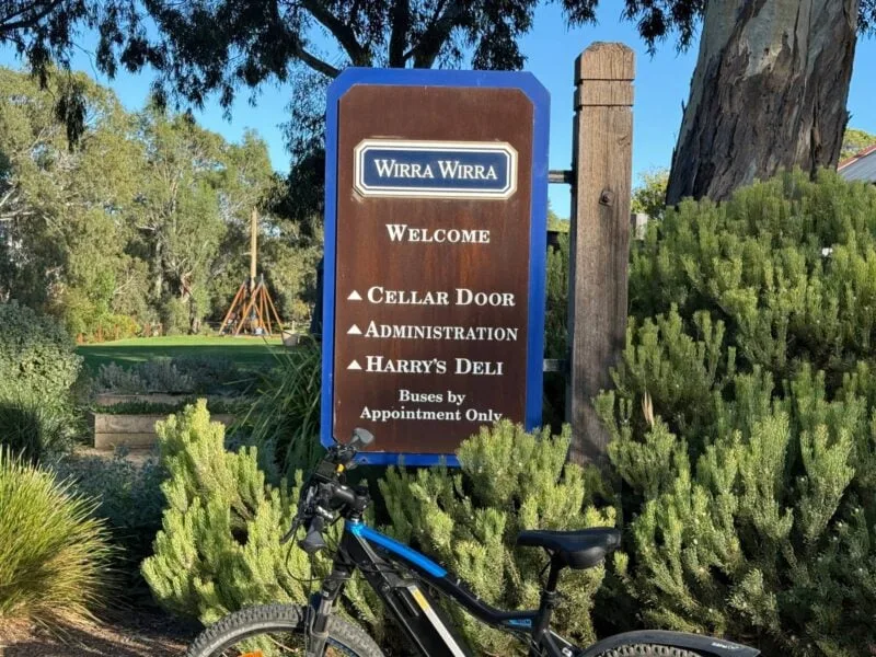 The Wirra Wirra cellar door sign with the trebuchon in the background